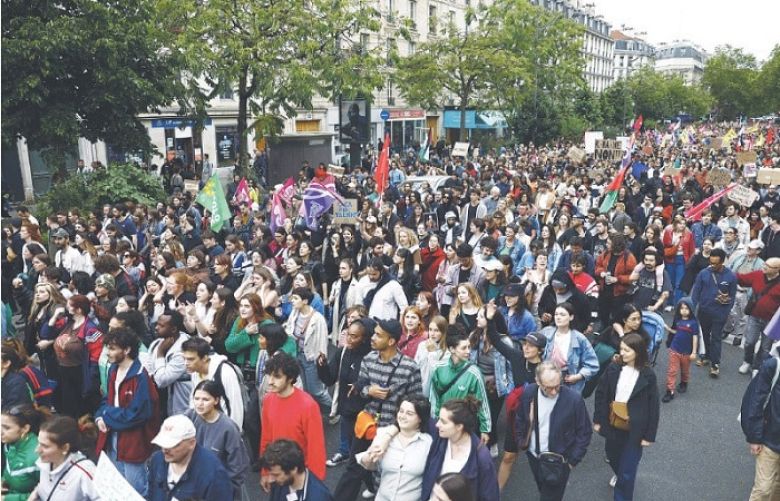 Thousands take to streets in France against assertive far right